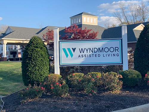 Building name on sign in front of Wyndmoor AL building